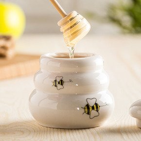 Porcelain honey pot with wooden dipper